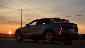 LYRIQ parked on a road with the sun rising in the background 